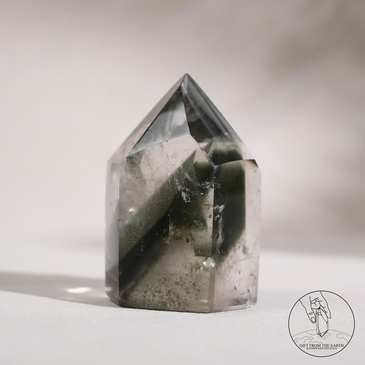 Half-polished multi-layered red-green phantom quartz point