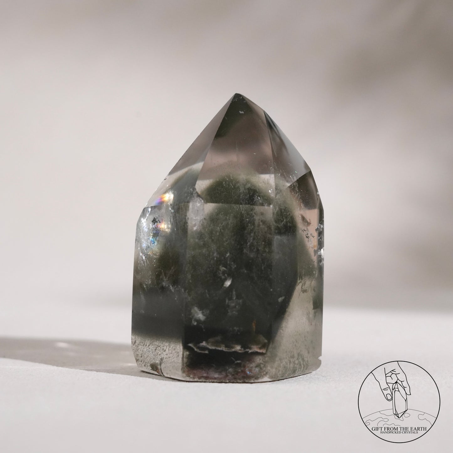 Half-polished multi-layered red-green phantom quartz point