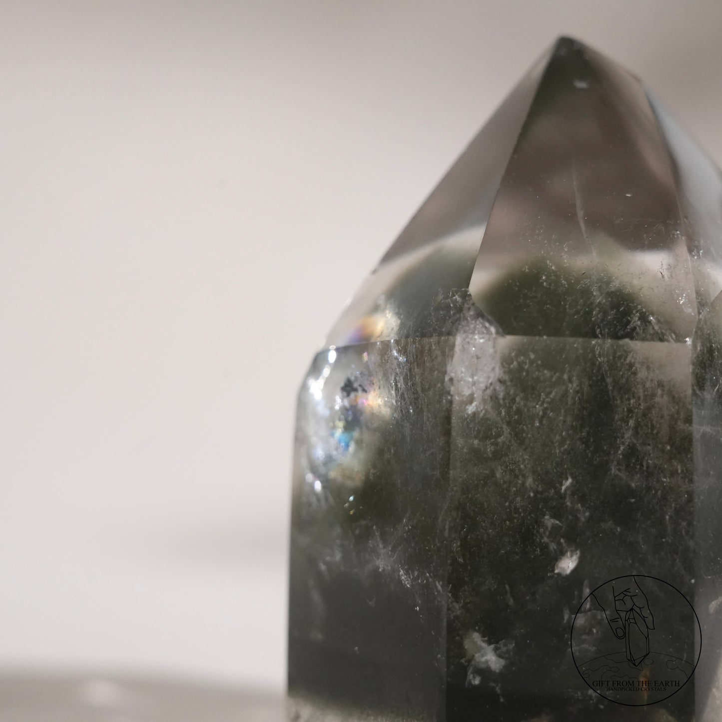 Half-polished multi-layered red-green phantom quartz point