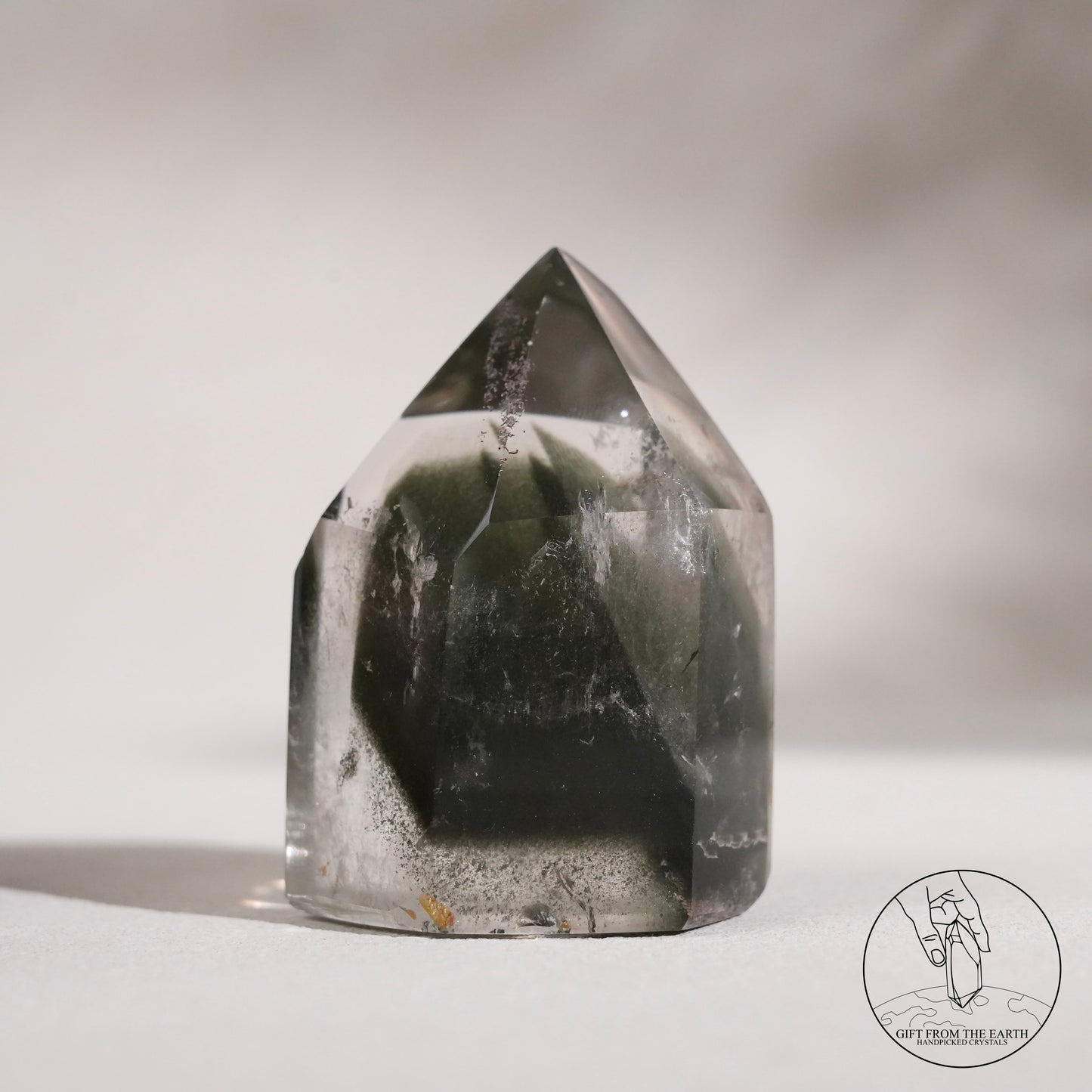 Half-polished multi-layered red-green phantom quartz point