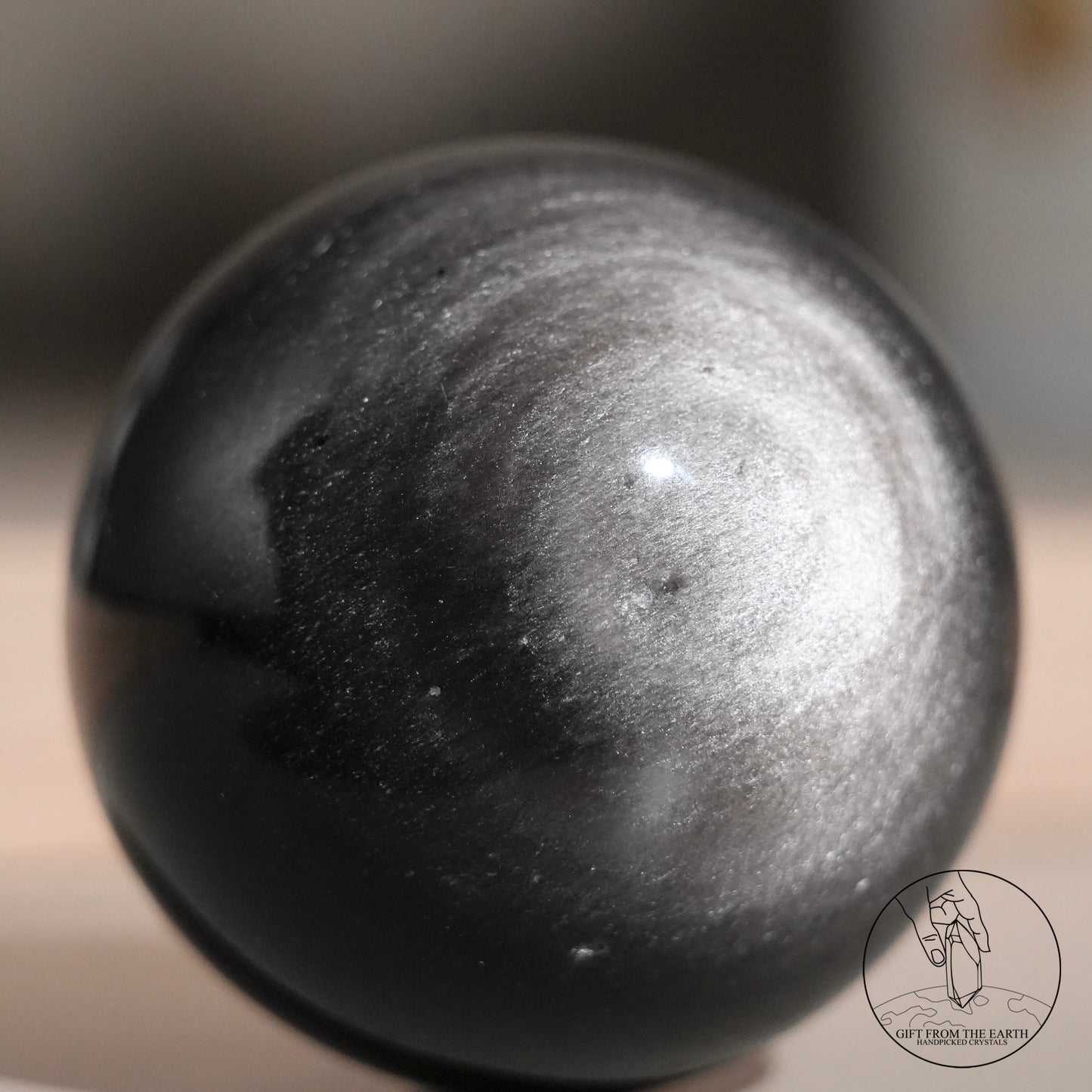 Silver sheen obsidian sphere