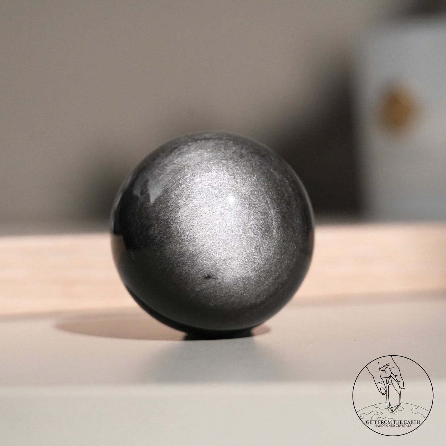 Silver sheen obsidian sphere