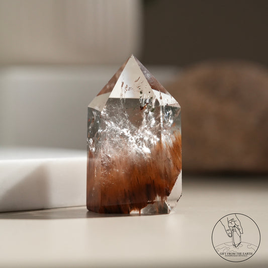 Half-polished red rabbit hair quartz point