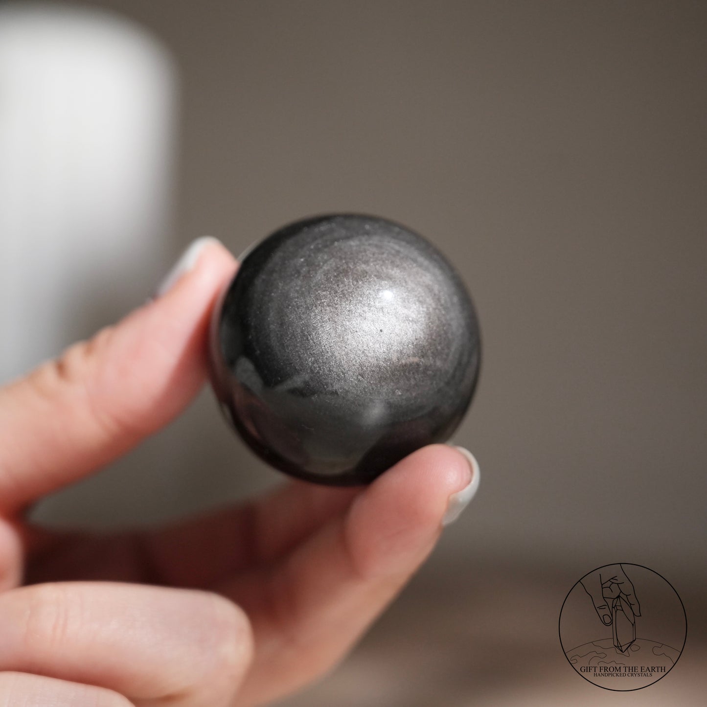 Silver sheen obsidian sphere
