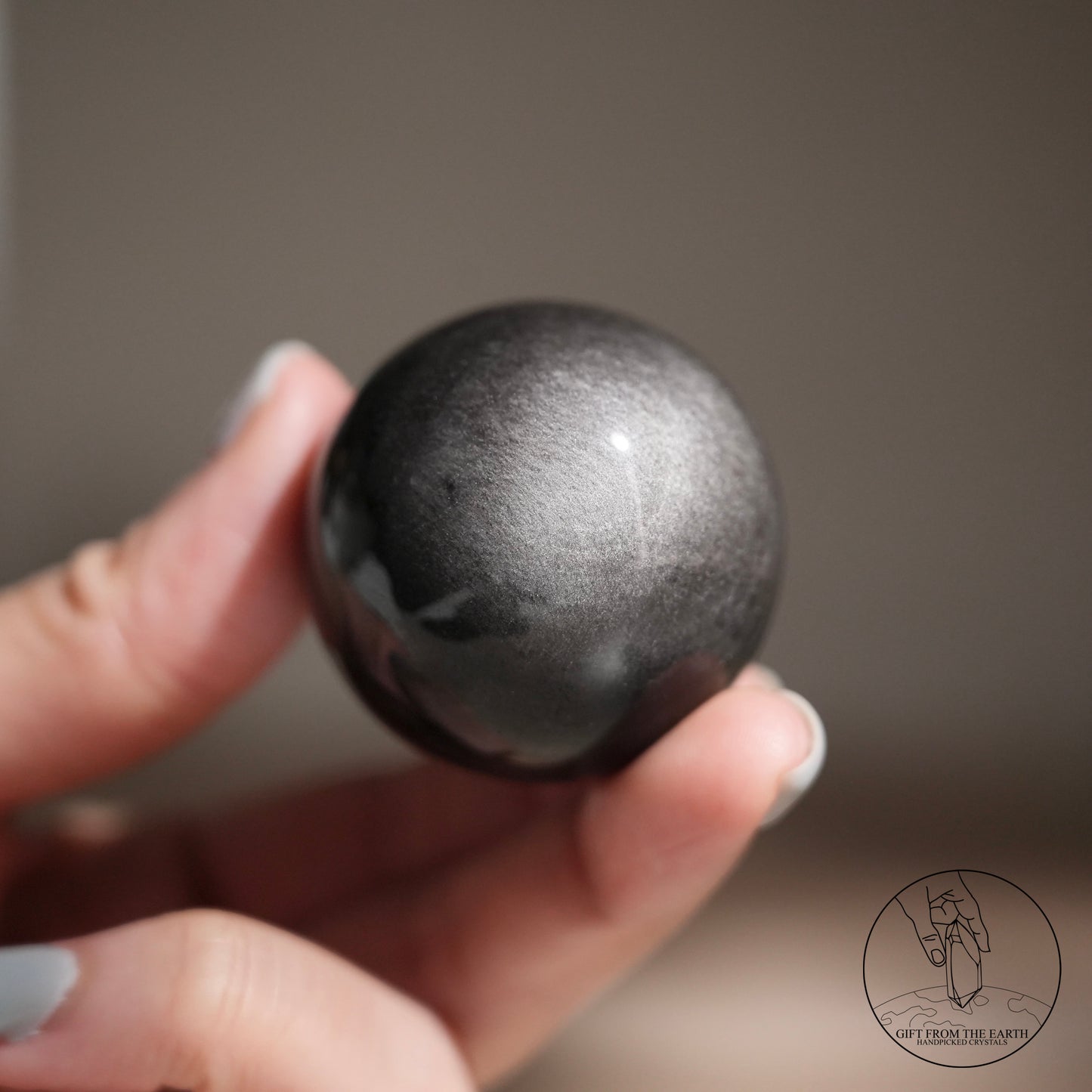 Silver sheen obsidian sphere