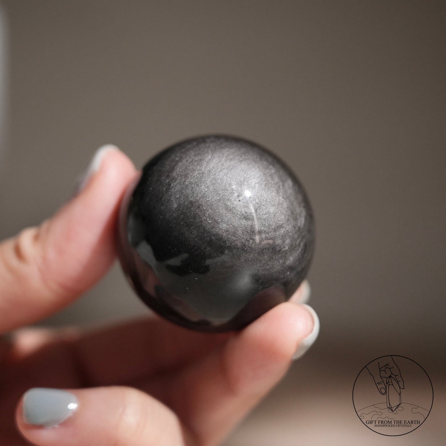 Silver sheen obsidian sphere