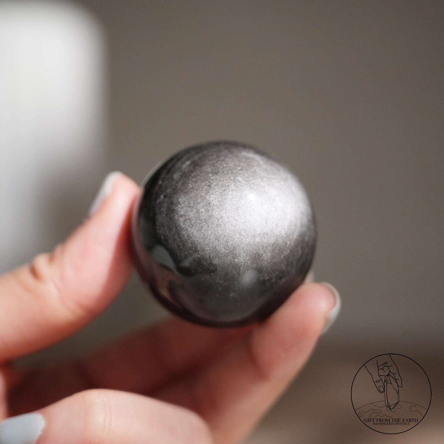 Silver sheen obsidian sphere