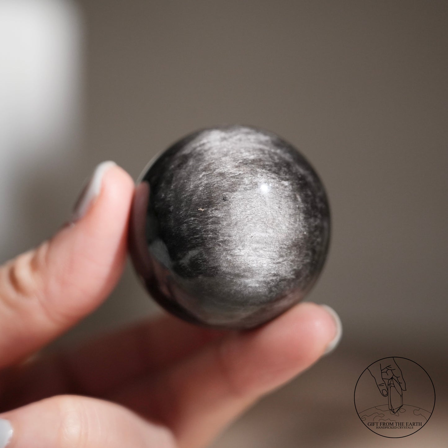 Silver sheen obsidian sphere