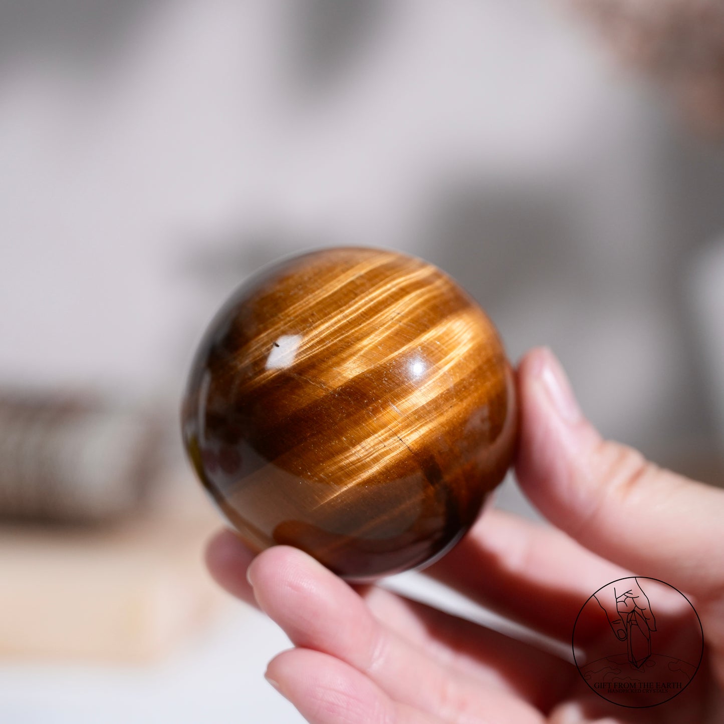 Yellow tiger's eye sphere