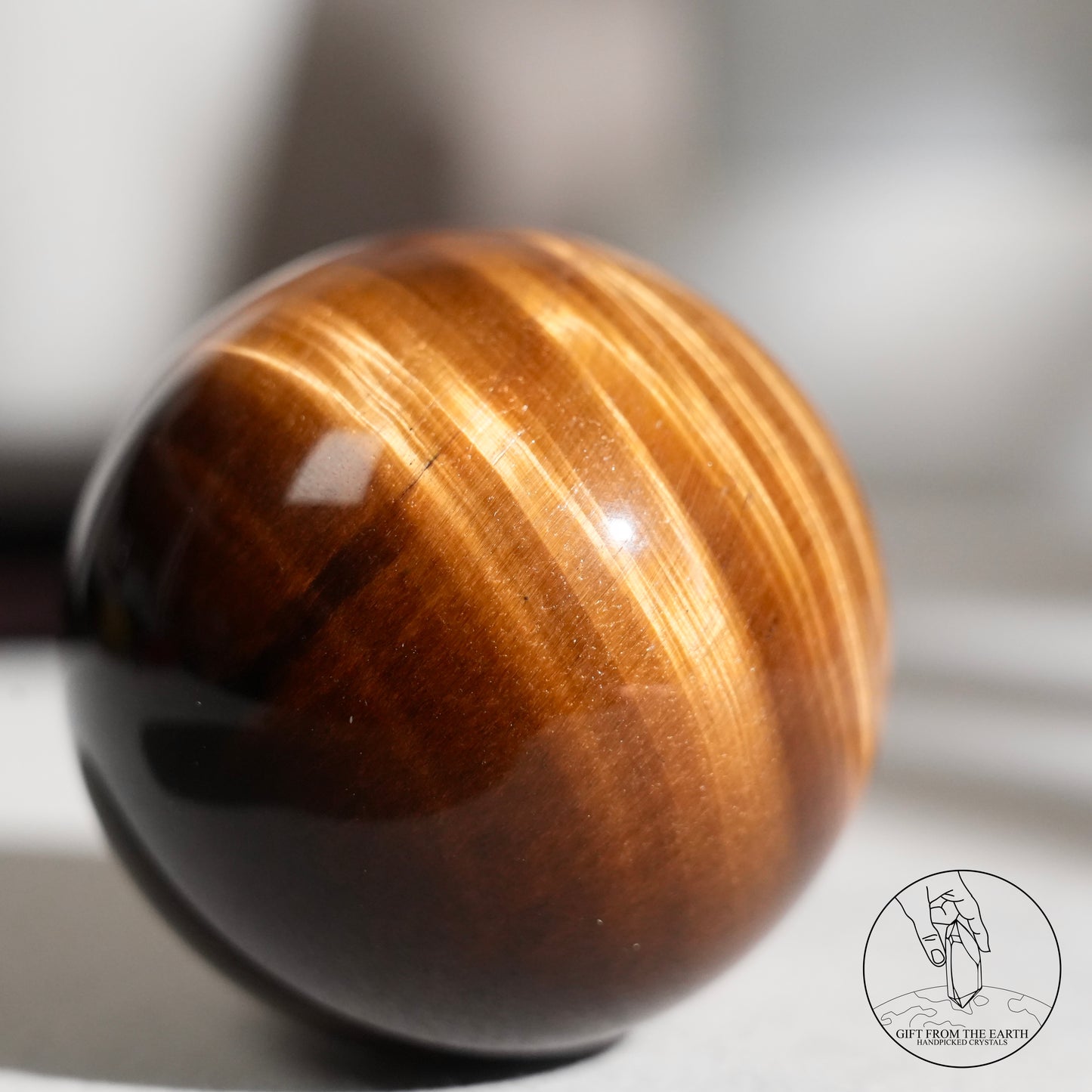 Yellow tiger's eye sphere