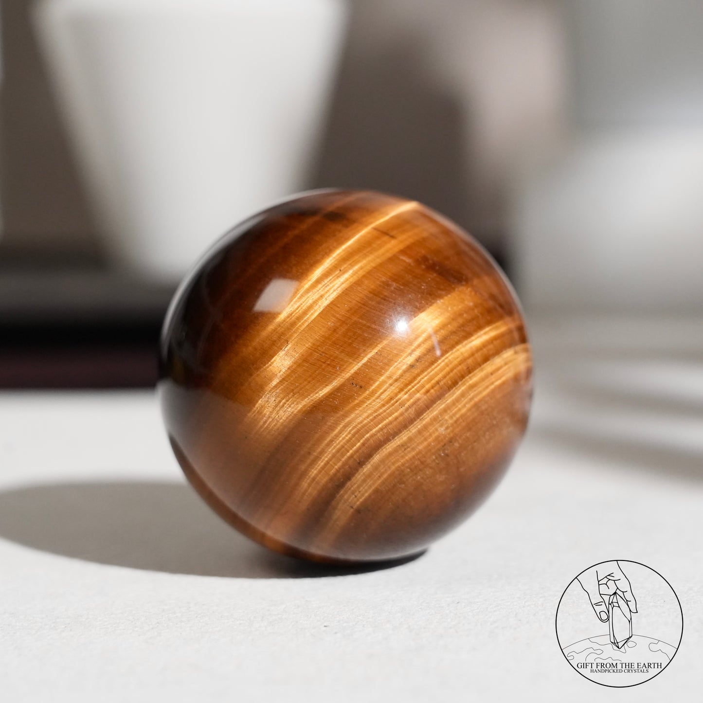 Yellow tiger's eye sphere