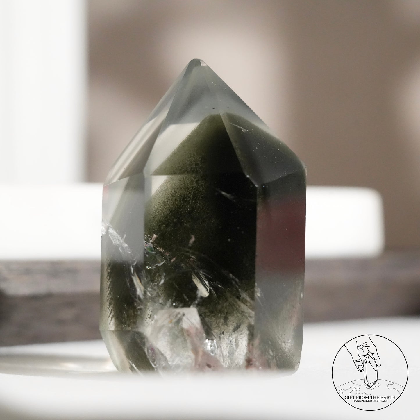 Half-polished multi-layered red-green phantom quartz point